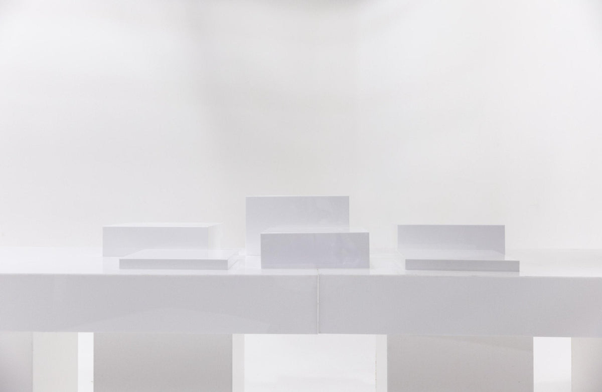 Classy Low White — Large-Format 6-Piece Low-Profile Acrylic Display Risers — front view — Plinths New York